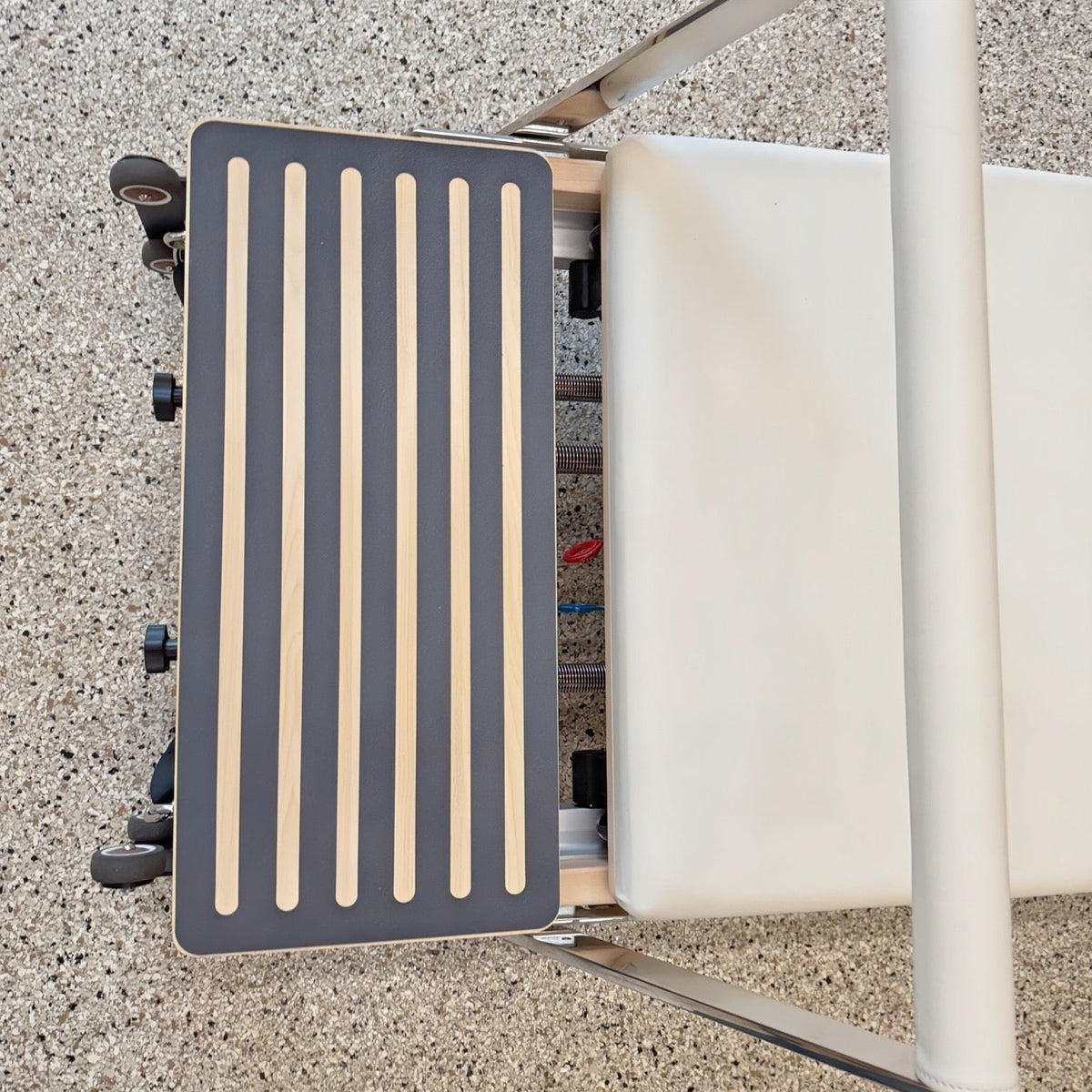 Wooden slatted seat for a modern chair, featuring a sleek design and sturdy construction.