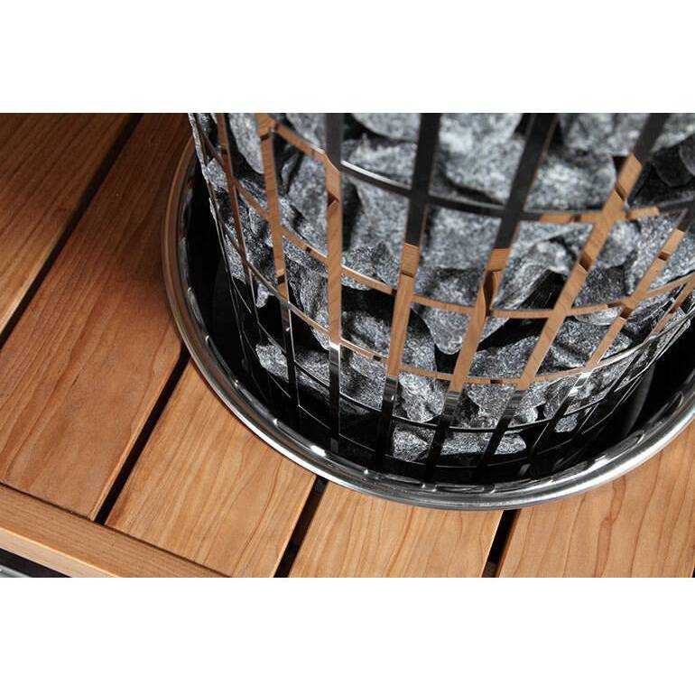 Stone sauna heater with black grid and silver base, designed for optimal heat distribution.