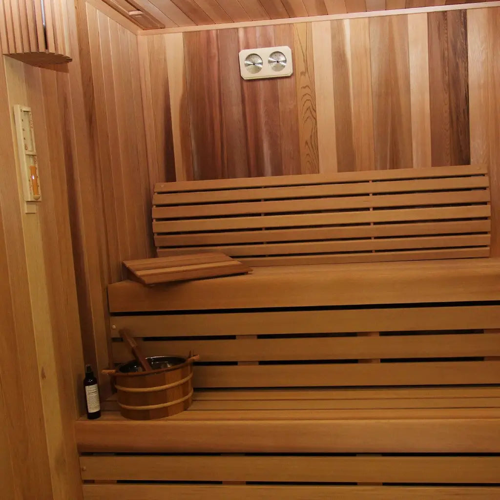 Wooden sauna interior featuring cedar benches and warm lighting.