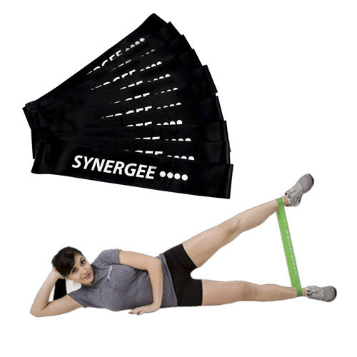 Synergee resistance bands in black with a woman using a green band for leg exercises.