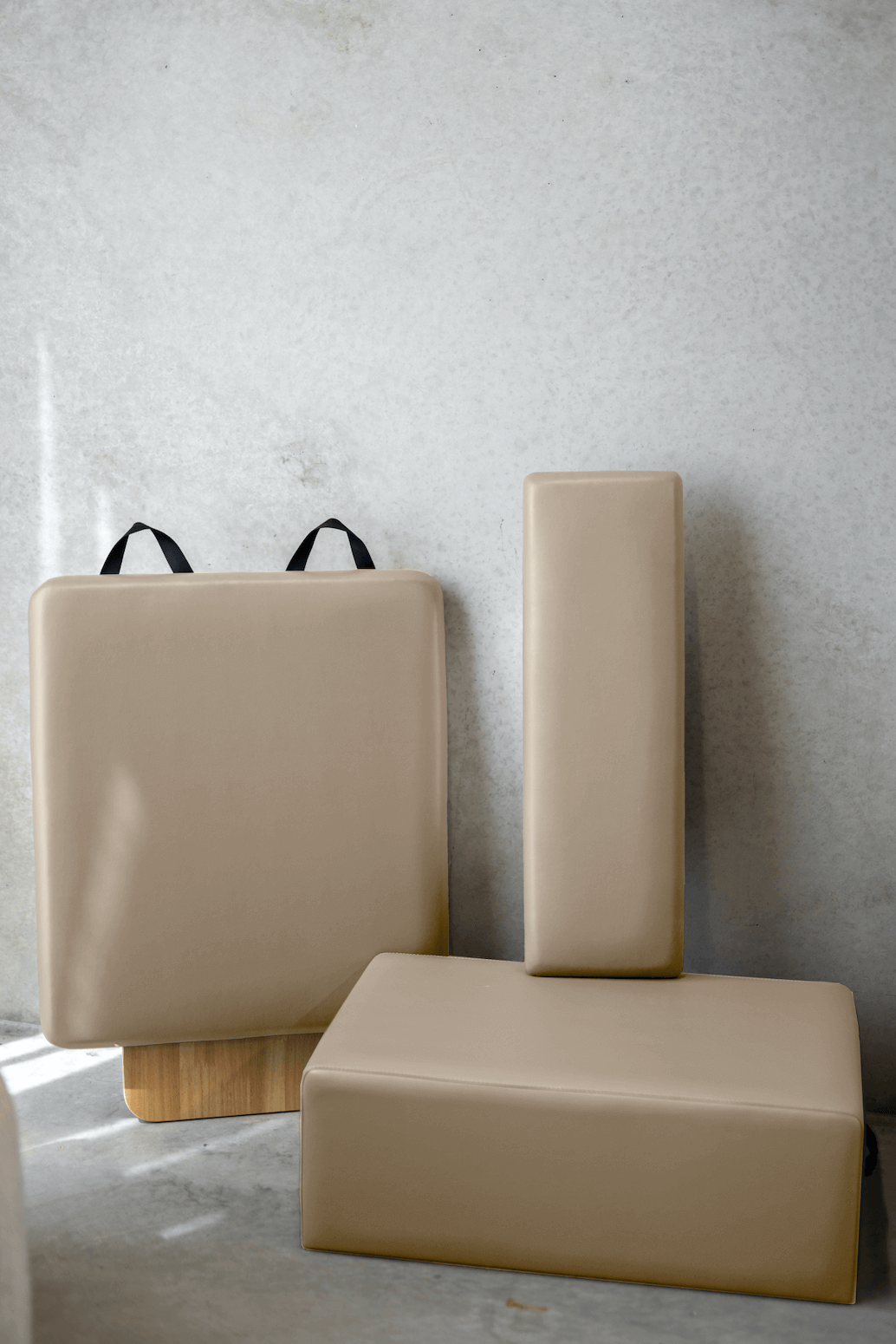 Beige Yoga Block Set with various shapes for versatile workouts.