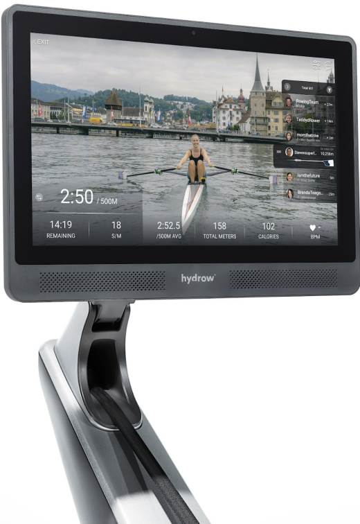 Hydrow rowing machine with a large screen displaying a rowing workout and scenic background.