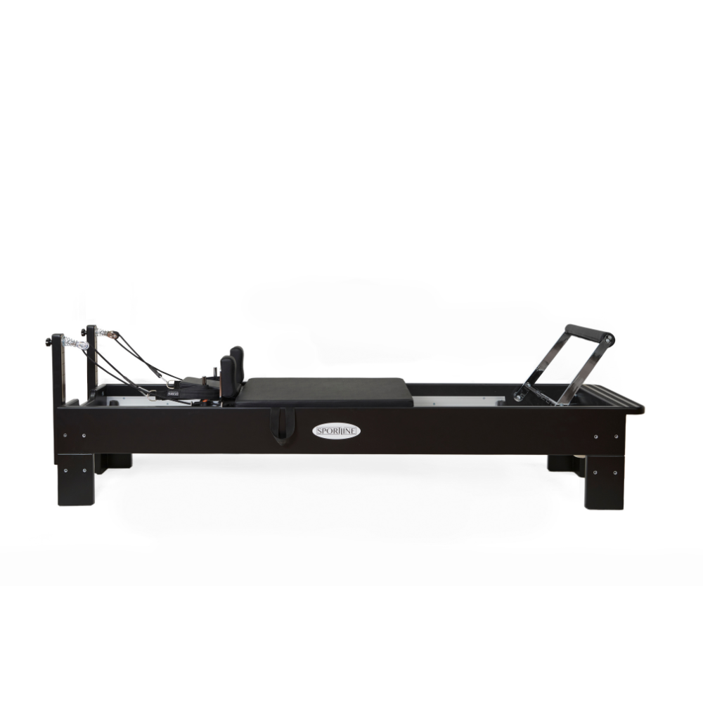 Pilates reformer with a sleek black design and adjustable components for versatile workouts.
