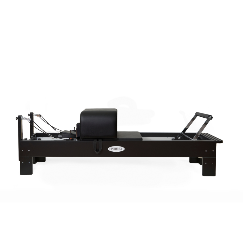 Reformer Pilates machine featuring a sleek black design and adjustable resistance.