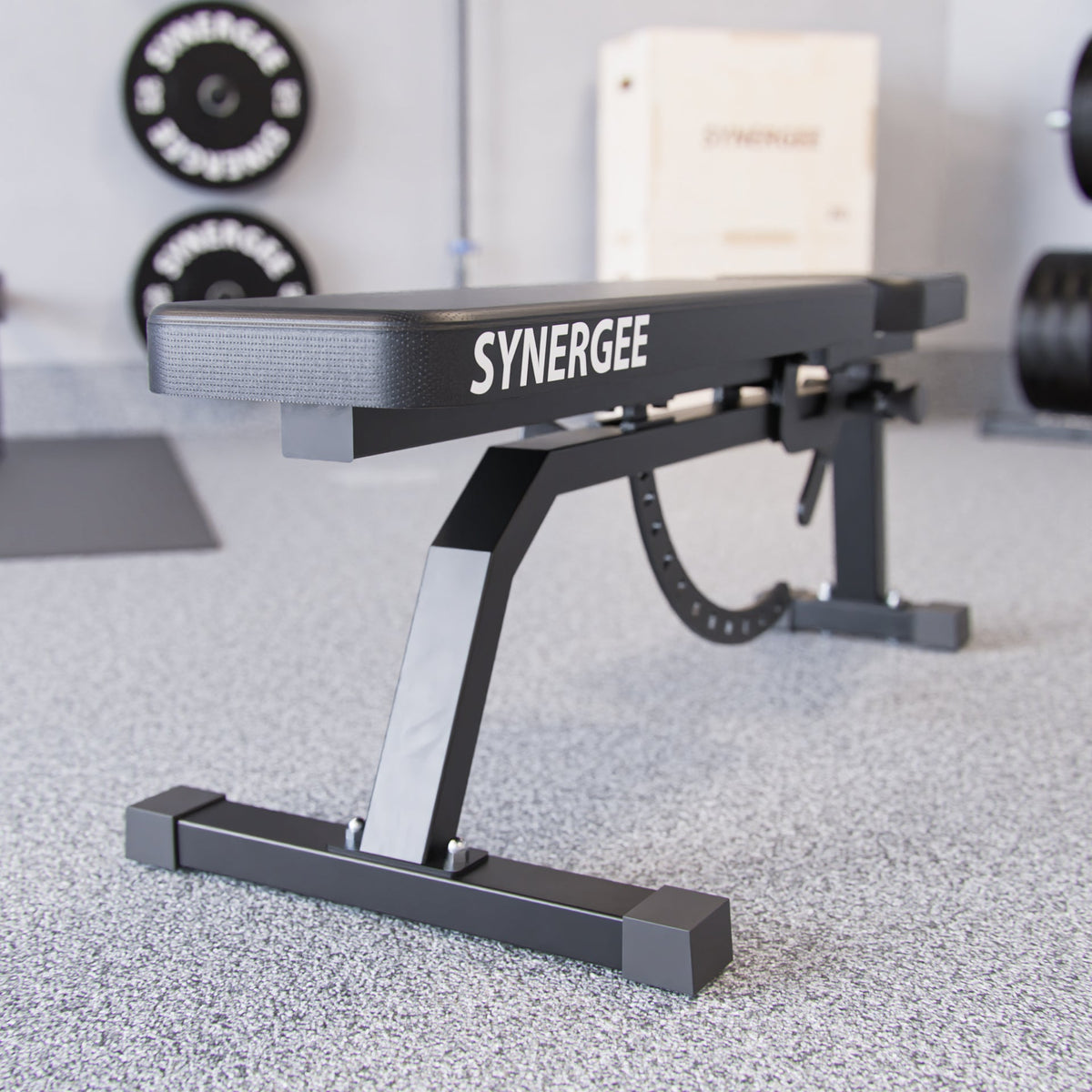Synergee adjustable weight bench with sturdy black frame and rubber feet for stability.