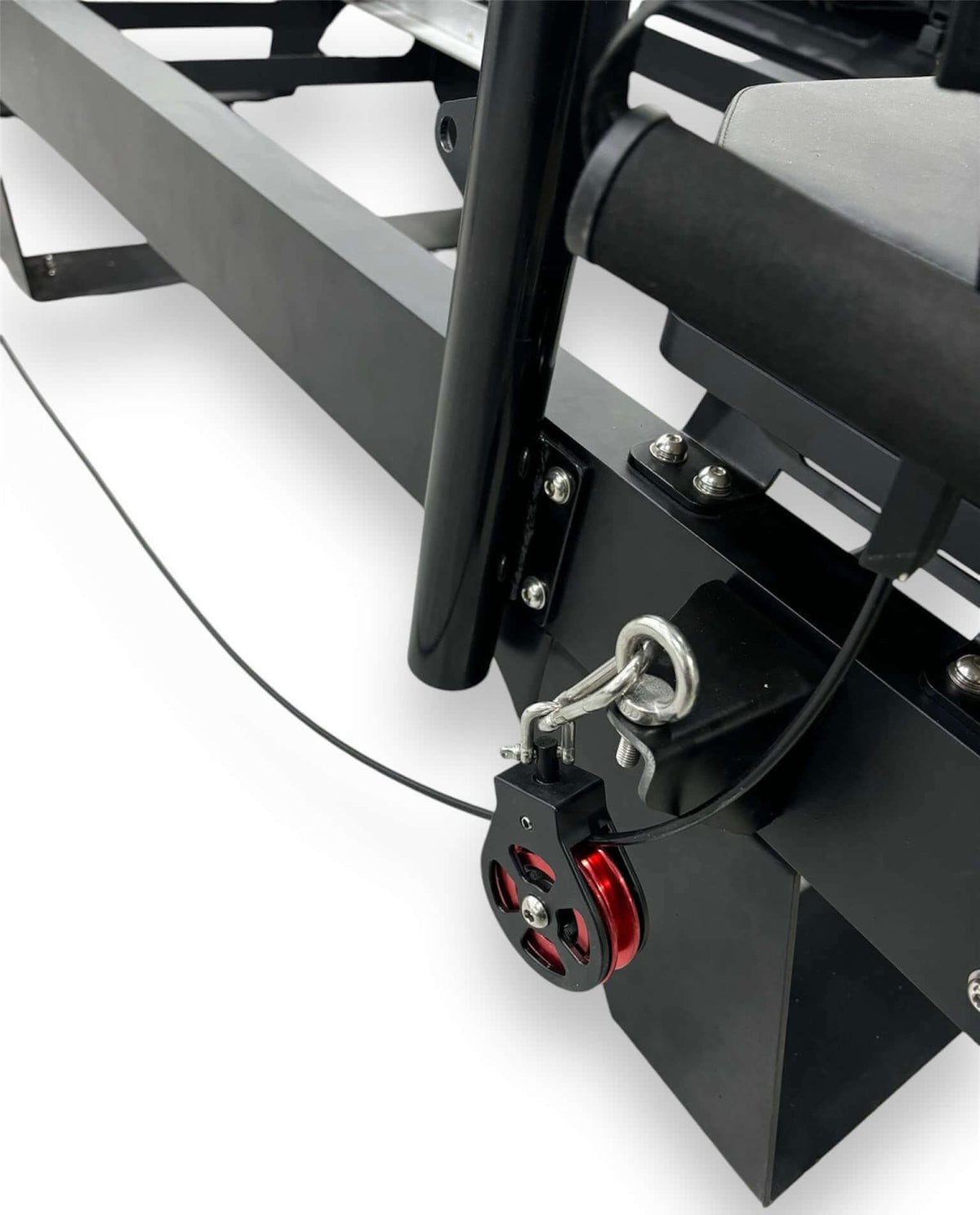Heavy-duty fishing boat trailer winch with red pulley and secure attachment.
