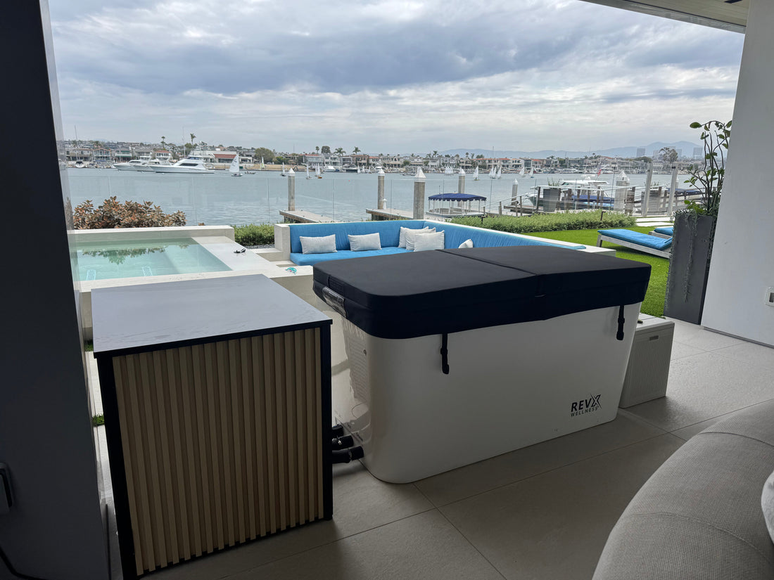 RevX acrylic cold plunge tub with chiller on a waterfront terrace