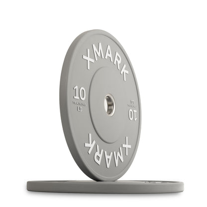XMark 10 lb weight plate in gray color with raised lettering for gym use.
