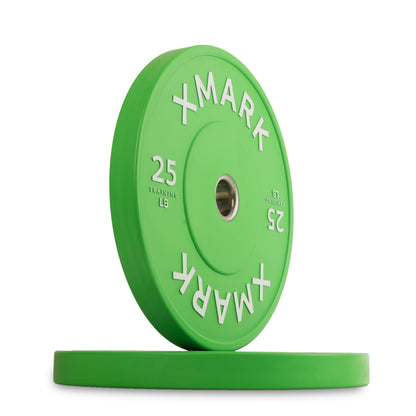 XMark 25 lb green rubber weight plate with white lettering for gym workouts.