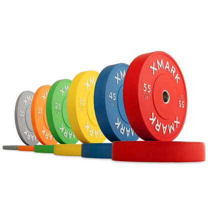 XMark color-coded bumper plates in various weights, including 55, 45, and 35 pounds.