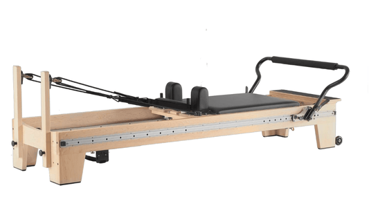 Pilates reformer with wooden frame and adjustable resistance for effective workouts.