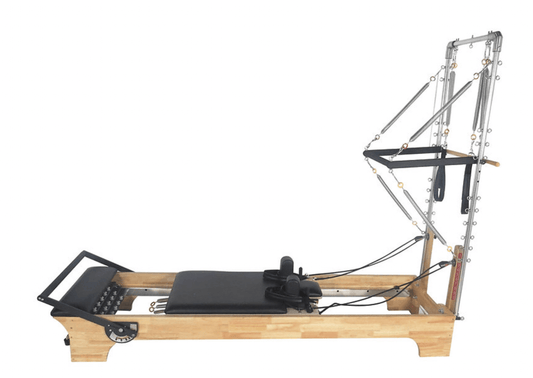 Pilates reformer machine with bamboo frame and adjustable resistance for effective workouts.